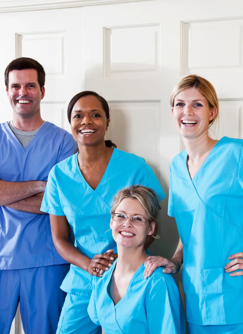 family medicine clinic team in blue scrubs
